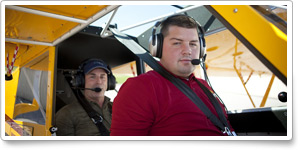 U.S. Marine Sgt. (ret.) Adam Kisielewski in the front seat of the 'Tougher than a Tornado' Husky