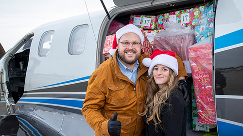 An airplane full of Christmas joy